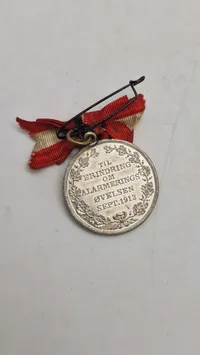 Original mindemedalje, der blev udstedt "TIL ERINDRING OM ALARMERINGS ØVELSEN SEPT. 1913"