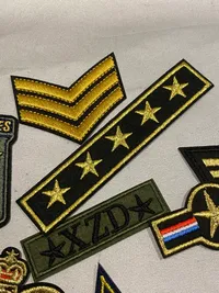 Lot diverse stofmærker bl.a. til at sy på tøjet