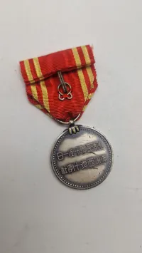 Original medalje fra Manchukuo Røde Kors Selskab, som blev oprettet i 1938 under den japanske besættelse af Manchuriet.