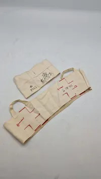 Samarit armbind og hjelmomslag