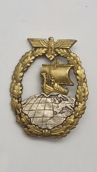 Originalt  Kriegsmarine.  Auxiliary Cruiser Badge,(Kriegsabzeichen für Hilfskreuzer) By C. E. Juncker