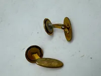 Originale manchetknapper, forsvaret