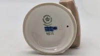 Royal Copenhagen månedsfigur kaldet "Dreng med mappe" eller "Juni Dreng"