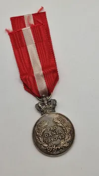 Sjælden originalt eks. af Kong Christian den X.s frihedsmedalje, også kendt som "Pro Dania” sølv