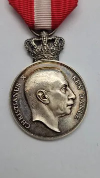 Sjælden originalt eks. af Kong Christian den X.s frihedsmedalje, også kendt som "Pro Dania” sølv