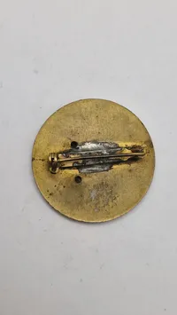 Originalt badge  fra De Forenede Nationers Beredskabsstyrke. (Første udgave af FN’s baretmærke)