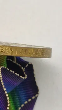 Original amerikansk sejrsmedalje fra Første Verdenskrig (World War I Victory Medal). Navngiven