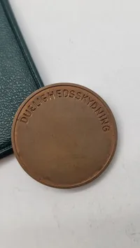 Original mønt fra det danske hjemmeværn for duelighedskydning med æske