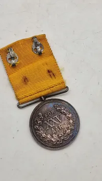 Original fortjenstmedalje fra Brandvæsenet i Danmark, præget i 1928. Sølv