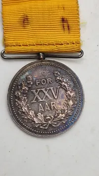 Original fortjenstmedalje fra Brandvæsenet i Danmark, præget i 1928. Sølv