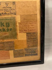 Samling originale rationeringsmærker i ramme