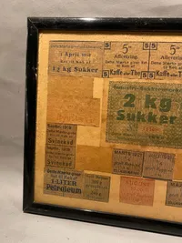Samling originale rationeringsmærker i ramme