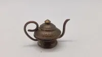 Små te kander lavet af mønter fra tiden omkring ww2