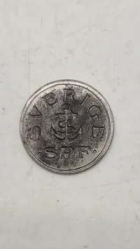 Original mindemedalje for panserskibet Sverige, præget i materiale fra skibets panserplader