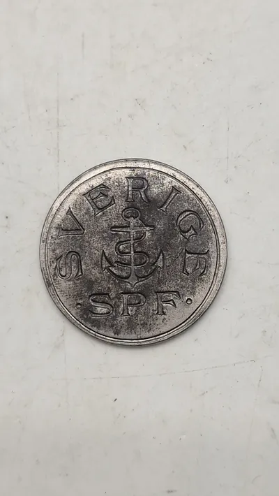 Original mindemedalje for panserskibet Sverige, præget i materiale fra skibets panserplader