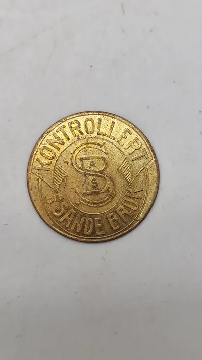 polet fra A/S Sande Bruk, brugt som et kontrolmærke til en 1-liters flaske. Brugt 1927-1942