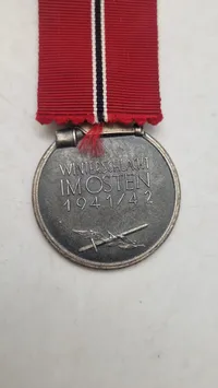 Original Medaille „Winterschlacht im Osten 1941/42“)