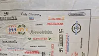 Unikt originalt klæde fra maj dagene 1945 med skitser til hvordan de syes