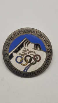 originalt badge fra de IV. Olympiske Vinterlege, der blev afholdt i Garmisch-Partenkirchen, Tyskland, i 1936