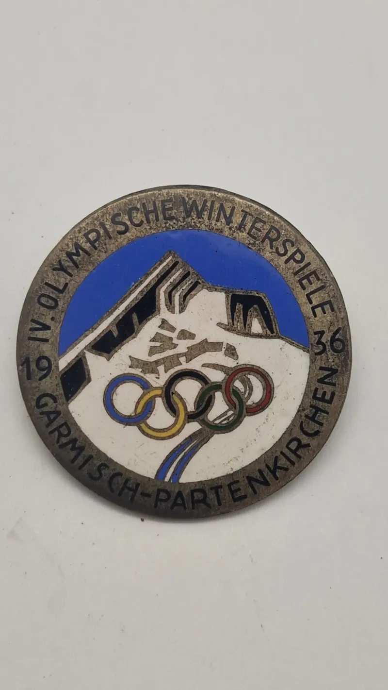 originalt badge fra de IV. Olympiske Vinterlege, der blev afholdt i Garmisch-Partenkirchen, Tyskland, i 1936