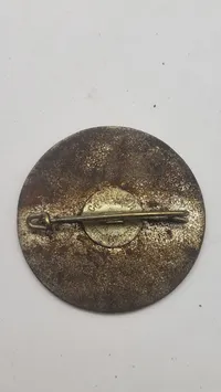 originalt badge fra de IV. Olympiske Vinterlege, der blev afholdt i Garmisch-Partenkirchen, Tyskland, i 1936