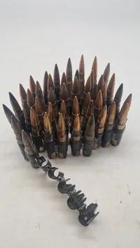 Bælte til mg/34/42 fra ww2 med deaktivererede patroner. Originalt