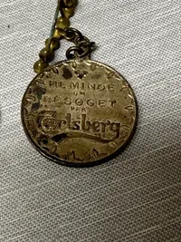 Samling Carlsberg medaljer, soltegn mm.