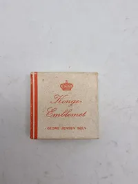 Originale æsker for Georg Jensens kongemærke
