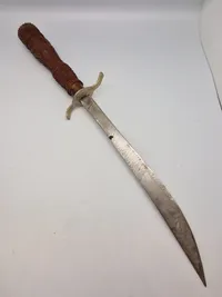 Ornate Indonesian Sword with Hand Carved Wooden Sheath