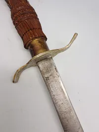 Ornate Indonesian Sword with Hand Carved Wooden Sheath