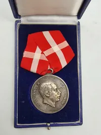 Original Kong Christian X fortjenestmedalje - sølv Navngiven: Anders Eilersen