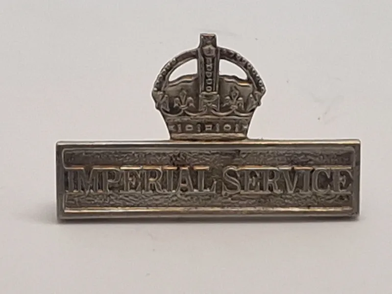 Imperial Service Badge. Dette mærke blev tildelt medlemmer af Territorial Force (TF) i Storbritannien, som var villige til at tjene uden for Storbritannien i tilfælde af en national nødsituation