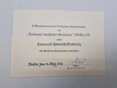 Originalt urkunde på  "Die Goldene Treuenadel" (Den Gyldne Trofasthedsnål)