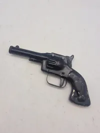 Helstøbt antik legetøjs revolver