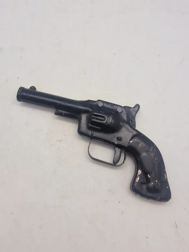 Helstøbt antik legetøjs revolver
