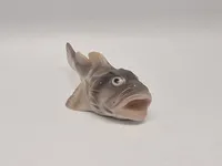 porcelænsfigur af en ulk, fremstillet af Bing & Grøndahl, nummer 2144.