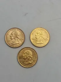3 forgyldte mønter quarter dollars