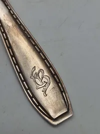 Gaffel med monogram antagelig fra Eva Bruun