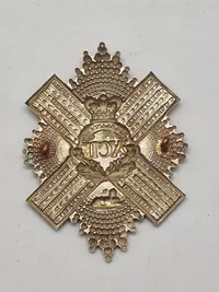 regimentsmærkeWW1/WW2  for The Gordon Highlanders, et tidligere infanteriregiment i den britiske hær.