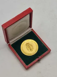 Original mønt for duelighedsskydning i HJV med æske