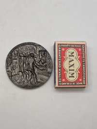 Original Lusitania-medaljon, som er en mindemedalje, der oprindeligt blev fremstillet i Tyskland i forbindelse med sænkningen af passagerskibet RMS Lusitania under Første Verdenskrig.