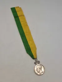 Original medalje fra Det Kongelige Patriotiska Sällskapet, tildelt Rudolf Ekberg for "Långvarig trogen tjenst" (langvarig trofast tjeneste).