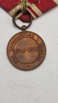 Dansk deltager medalje fra 1848-50 krigen med krydsbånd. Original