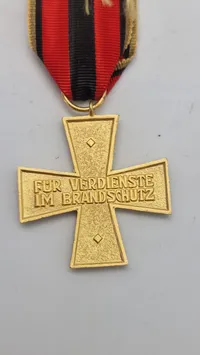 Tysk brandsikringshæderstegn (Feuerwehrehrenkreuz), specifikt fra delstaten Rheinland-Pfalz. Original