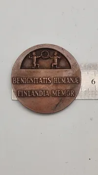 Finsk bronzemedalje fra 1946 med titlen “Benignitatis Humanae Finlandia Memor”.