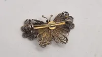 Filigran broche af 830 sølv