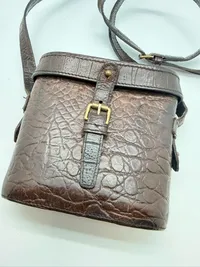 A MULBERRY BROWN CROCODILE LEATHER HAND BAG, binocular style, original