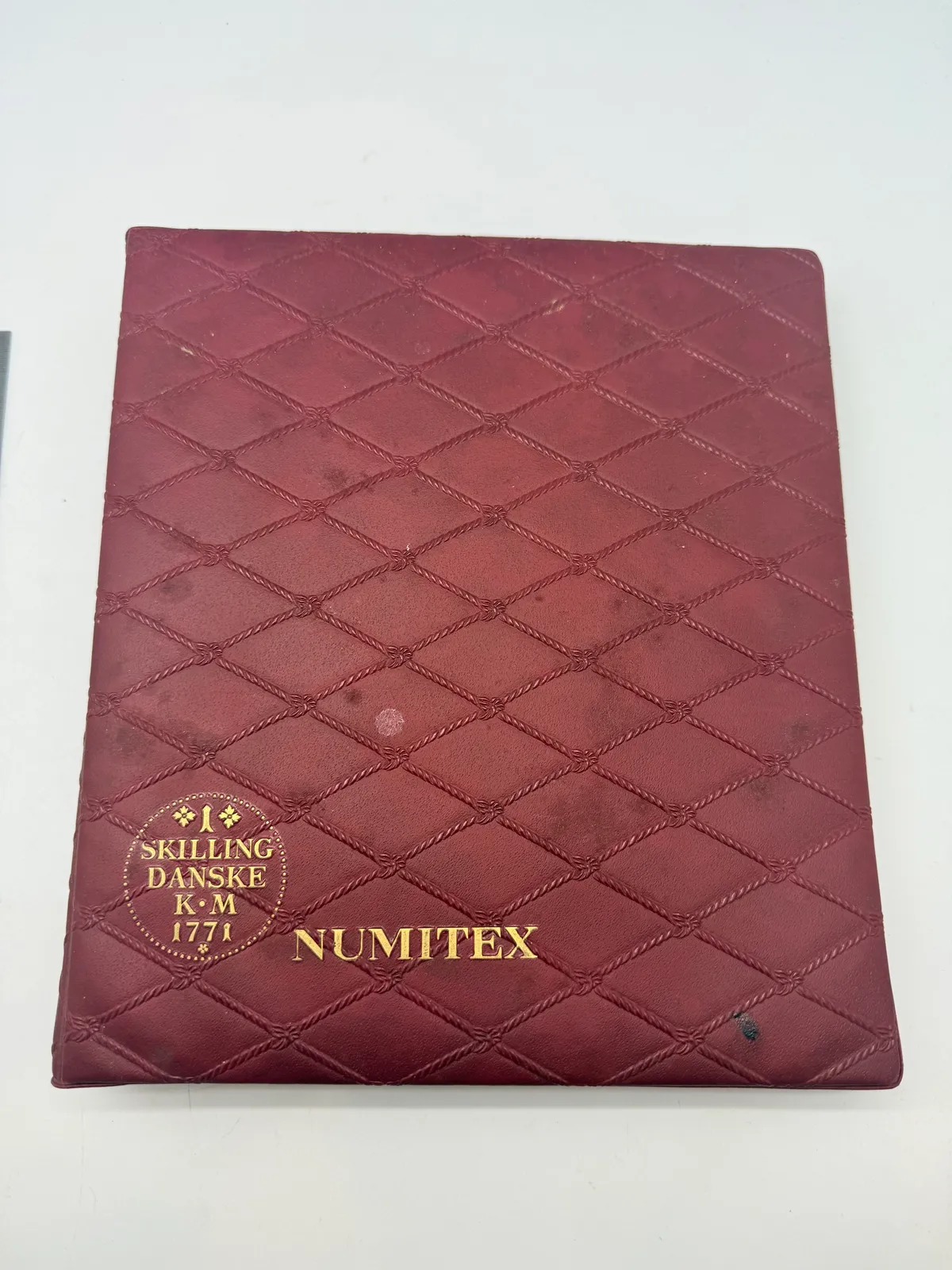 Møntsamling med album