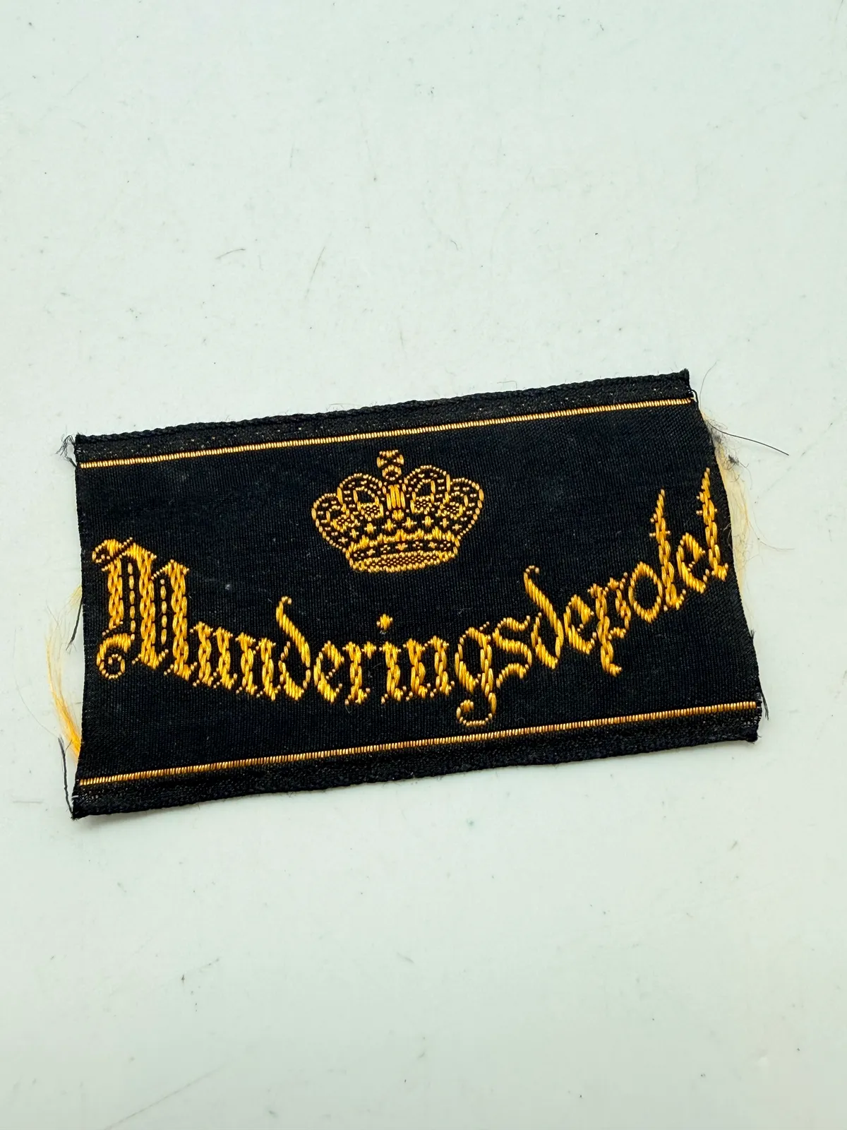 Uniformsmærke munderings depotet