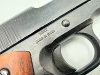 Colt m1911,  Denix metal kan tage ladegreb